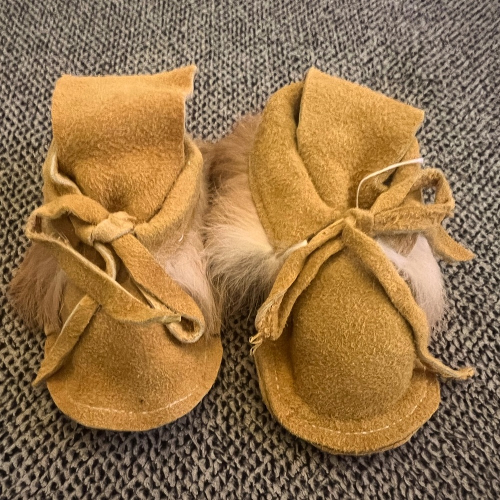 NWOT infant moccasins with fur.